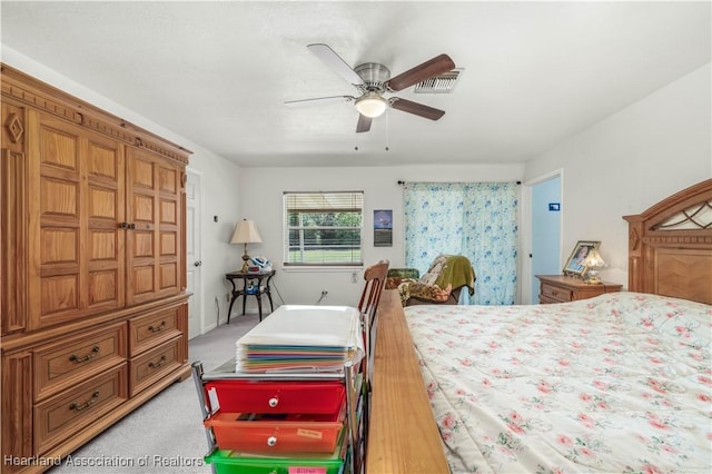 bedroom with ceiling fan and carpet