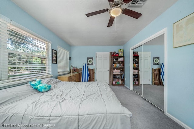 bedroom featuring ceiling fan, carpet floors, and a closet