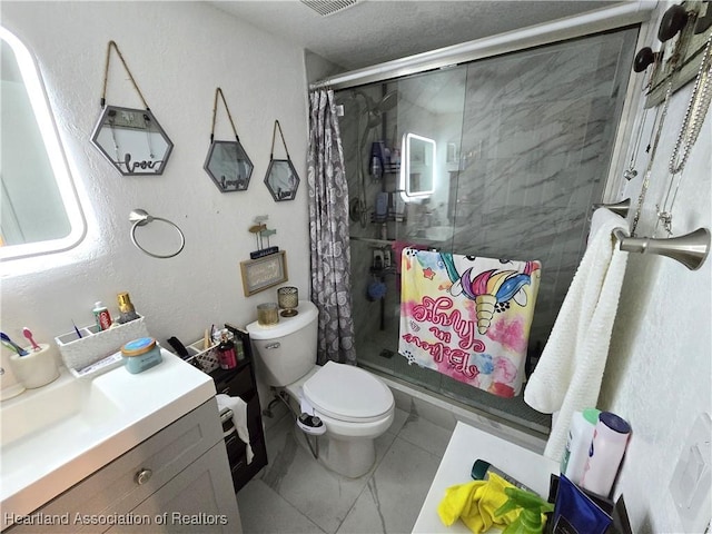 bathroom with walk in shower, tile patterned floors, vanity, and toilet