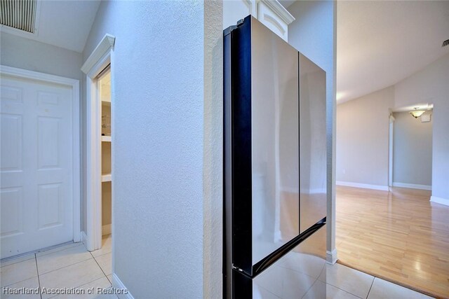 1465 Berwin Ave, Avon Park, FL 33825 - corridor featuring a textured wall and light tile patterned floors