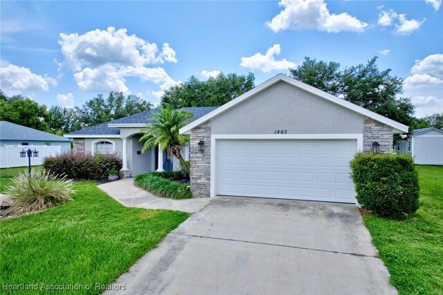 1465 Berwin Ave, Avon Park, FL 33825 - ranch-style home featuring stone siding, stucco siding, a front yard, and driveway