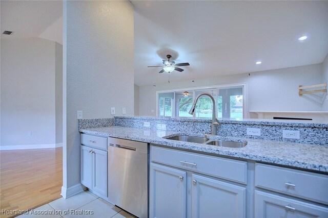 1465 Berwin Ave, Avon Park, FL 33825 - kitchen with stainless steel dishwasher, light stone countertops, a ceiling fan, light tile patterned floors, and recessed lighting