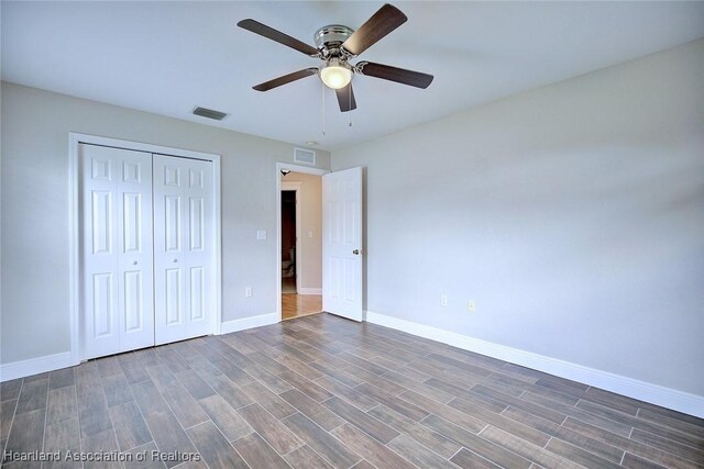 1465 Berwin Ave, Avon Park, FL 33825 - unfurnished bedroom with a closet, wood finished floors, and a ceiling fan