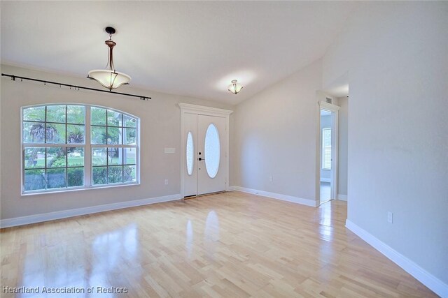 1465 Berwin Ave, Avon Park, FL 33825 - foyer with light wood-type flooring and vaulted ceiling