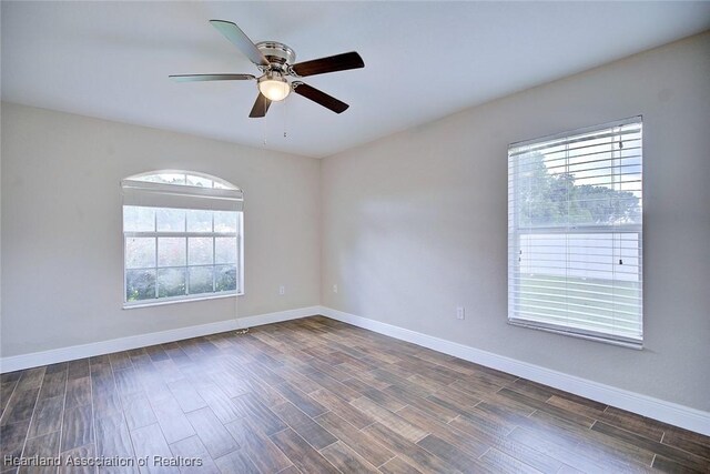 1465 Berwin Ave, Avon Park, FL 33825 - unfurnished room featuring plenty of natural light, ceiling fan, and dark wood-style flooring