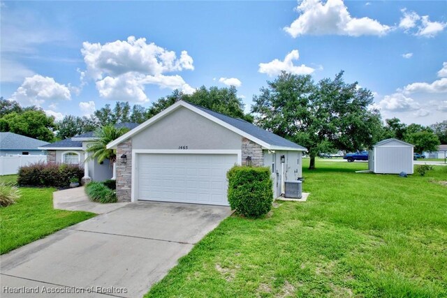 1465 Berwin Ave, Avon Park, FL 33825 - ranch-style home featuring stone siding, a front yard, stucco siding, driveway, and an attached garage