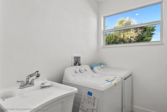 washroom featuring sink and washer and dryer