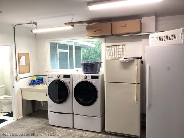 136 Hallmark Ave, Lake Placid, FL 33852 - washroom with independent washer and dryer