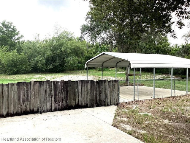 136 Hallmark Ave, Lake Placid, FL 33852 - view of parking with a detached carport