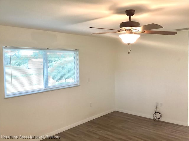 136 Hallmark Ave, Lake Placid, FL 33852 - unfurnished room with dark wood-type flooring, a ceiling fan, and baseboards