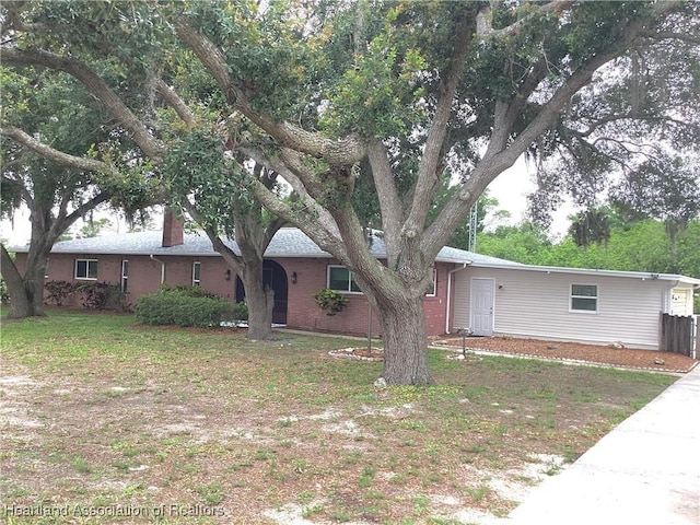 136 Hallmark Ave, Lake Placid, FL 33852 - ranch-style house featuring brick siding
