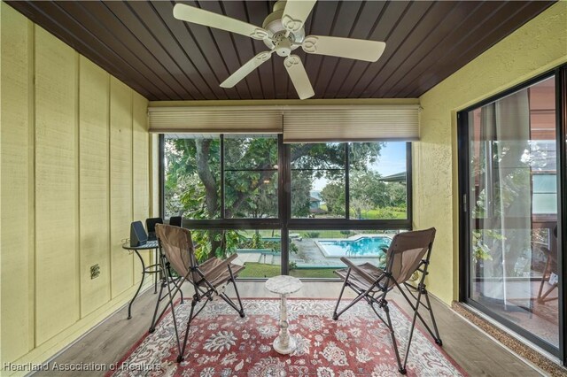 sunroom with ceiling fan and a healthy amount of sunlight