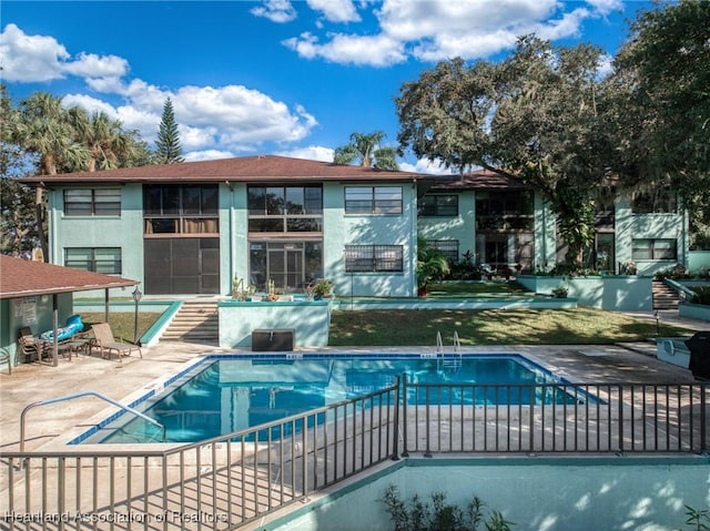 view of pool featuring a patio