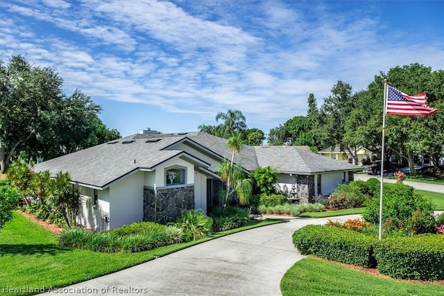 single story home with a front yard