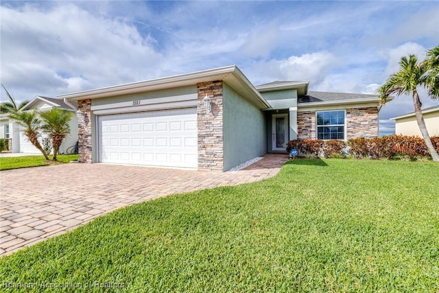 ranch-style home featuring decorative driveway, stucco siding, a garage, stone siding, and a front lawn