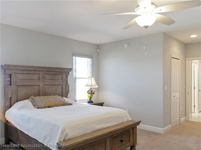 carpeted bedroom with ceiling fan