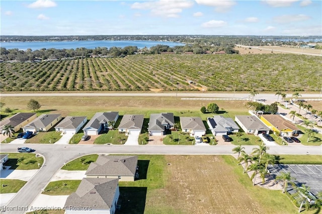 birds eye view of property with a rural view and a water view