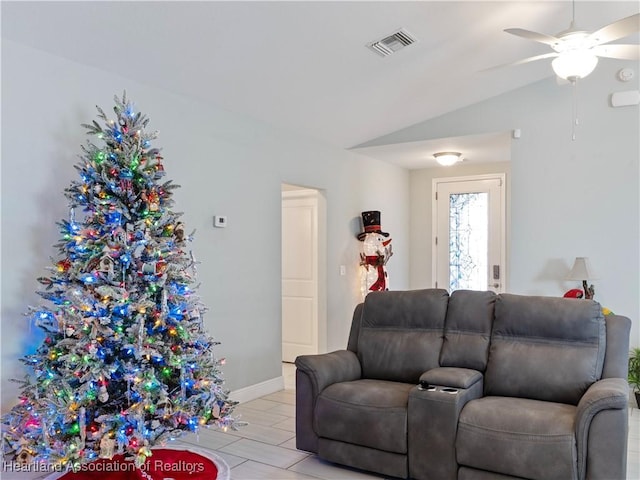 living room with ceiling fan and lofted ceiling