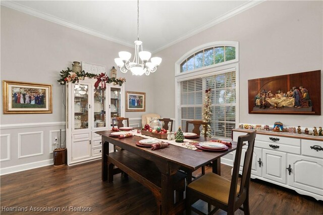 dining area with ornamental molding, dark wood-type flooring, and a notable chandelier