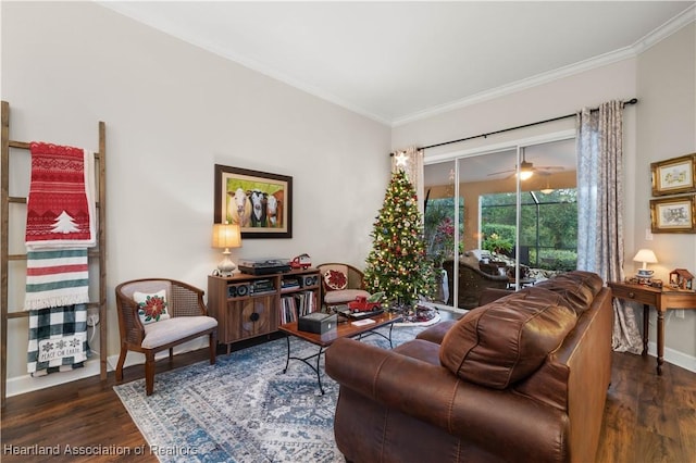 living room with dark hardwood / wood-style floors and crown molding