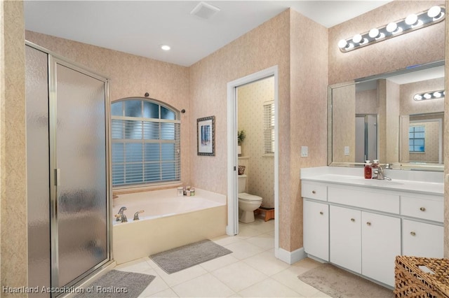 full bathroom with tile patterned floors, vanity, toilet, and independent shower and bath