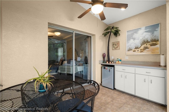 interior space with ceiling fan