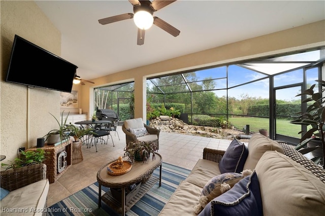 view of patio / terrace with a lanai, ceiling fan, and an outdoor hangout area