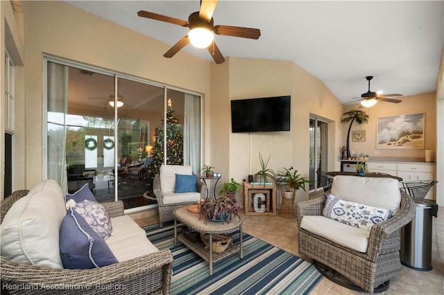 interior space with an outdoor hangout area and ceiling fan