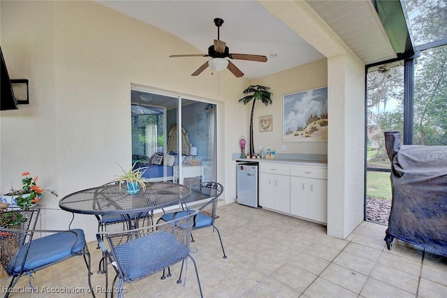 view of patio featuring ceiling fan and outdoor dining area