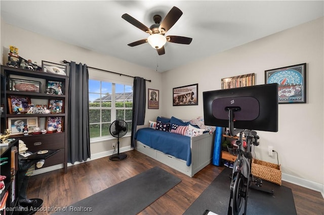 bedroom featuring ceiling fan and dark hardwood / wood-style floors