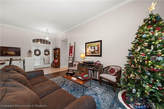 living room featuring crown molding, french doors, and wood-type flooring