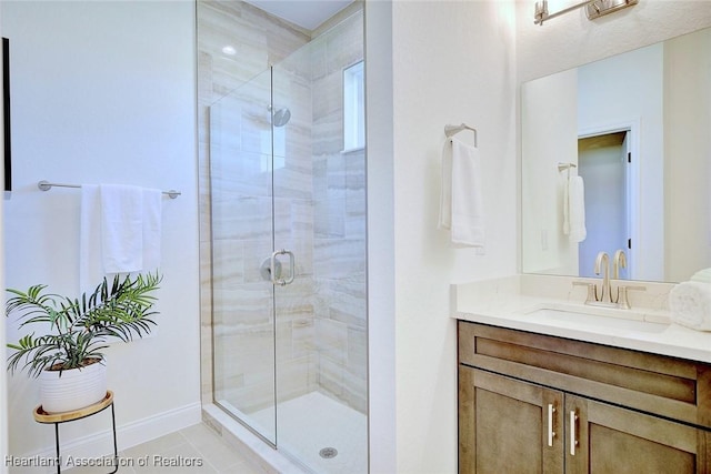 bathroom featuring vanity, an enclosed shower, and tile patterned flooring