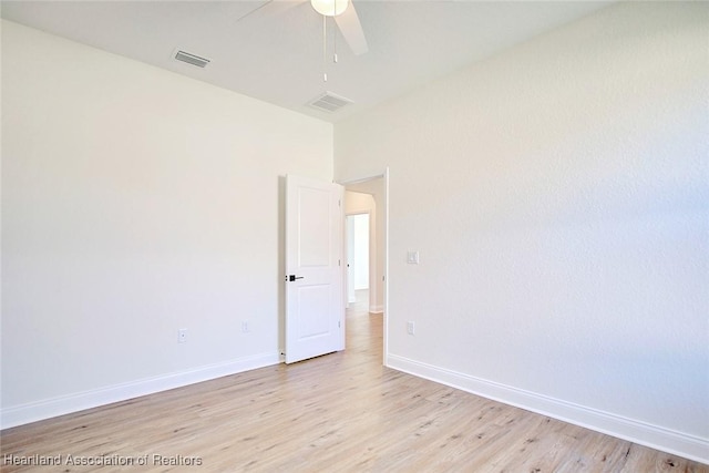 unfurnished room with ceiling fan and light hardwood / wood-style flooring