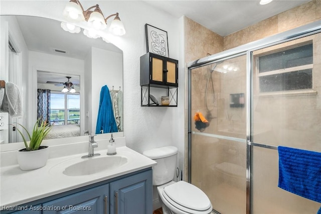 ensuite bathroom with toilet, ensuite bath, ceiling fan, vanity, and a shower stall