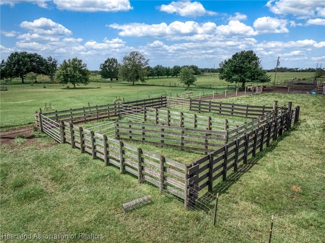 view of yard with a rural view