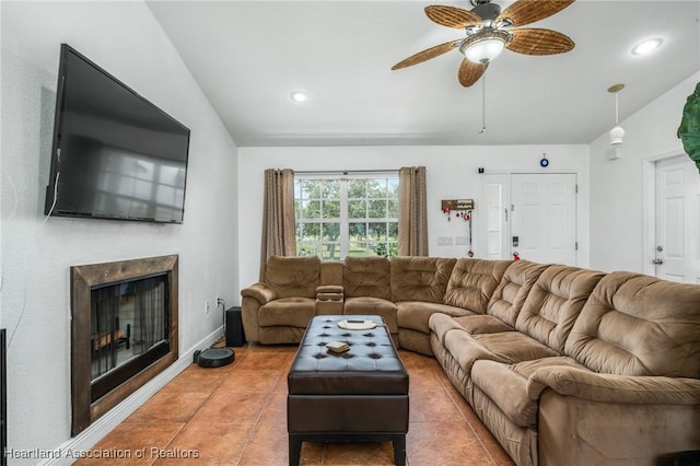 living area featuring a fireplace, recessed lighting, a ceiling fan, vaulted ceiling, and tile patterned floors