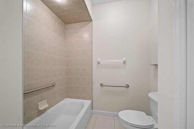 bathroom with tile patterned floors, shower / bathtub combination, and toilet