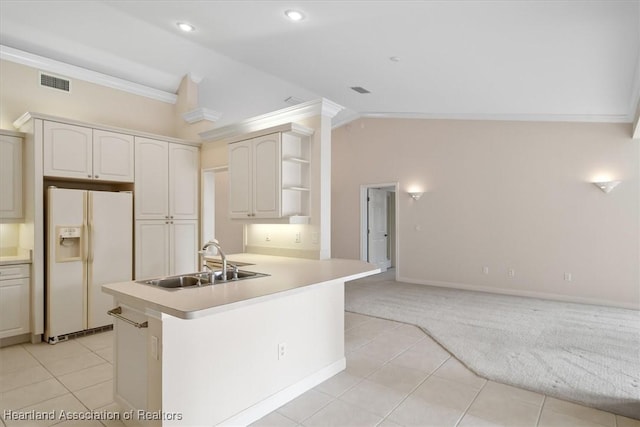 kitchen featuring light carpet, sink, white fridge with ice dispenser, ornamental molding, and kitchen peninsula