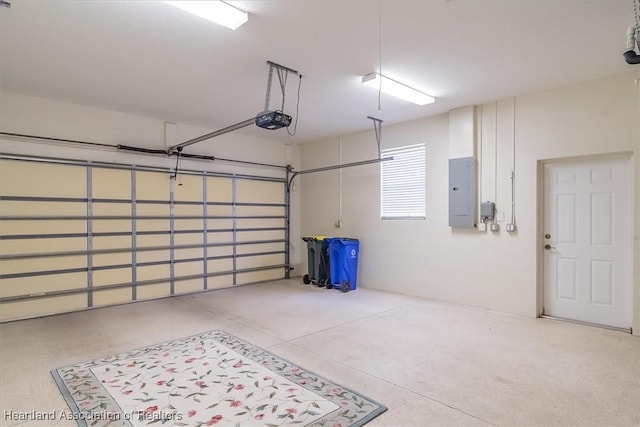 garage with electric panel and a garage door opener