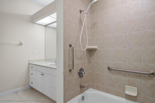 bathroom with vanity, tile patterned floors, and tiled shower / bath