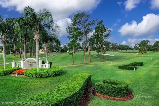 view of property's community featuring a yard