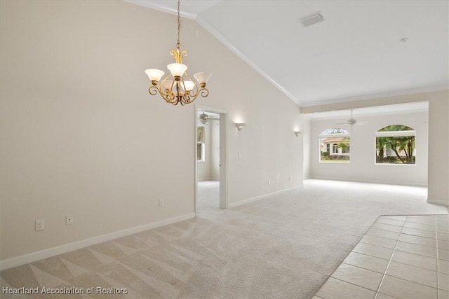 spare room with ceiling fan with notable chandelier, light colored carpet, crown molding, and high vaulted ceiling