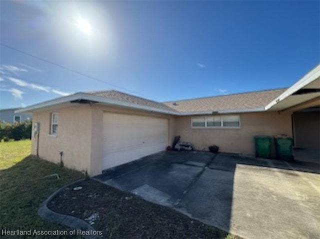 view of property exterior featuring a garage