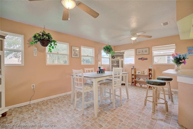 dining area with ceiling fan