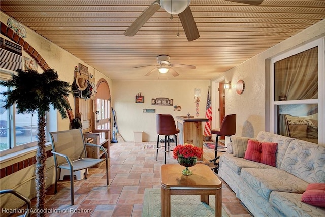 living room with a wealth of natural light and wood ceiling