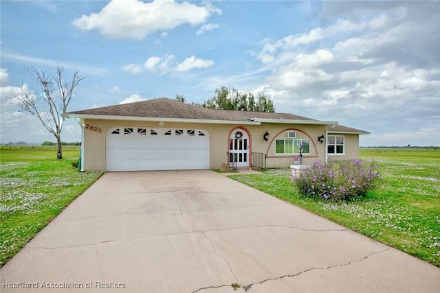 ranch-style house with a garage and a front yard