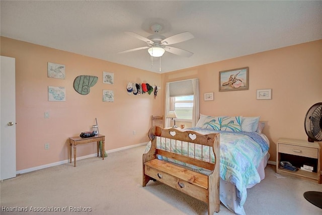 bedroom featuring ceiling fan and light colored carpet