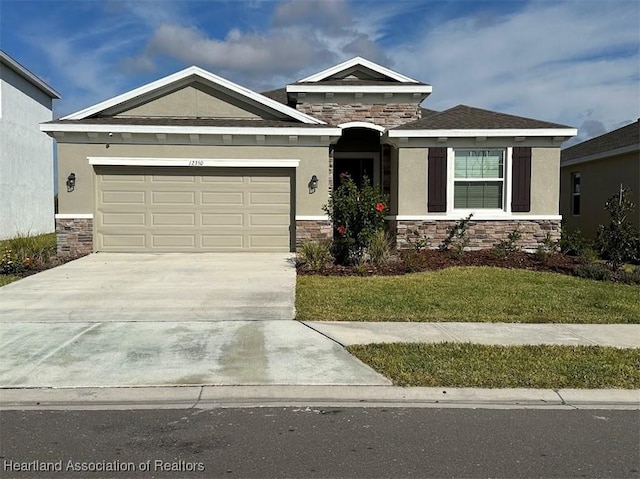 view of front facade with a garage and a front lawn