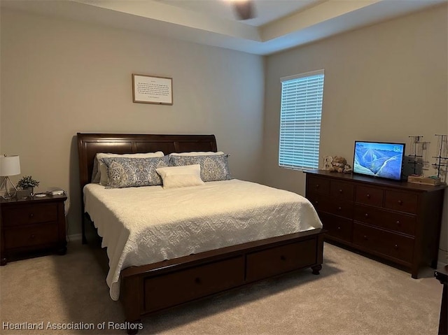 bedroom with ceiling fan and light colored carpet