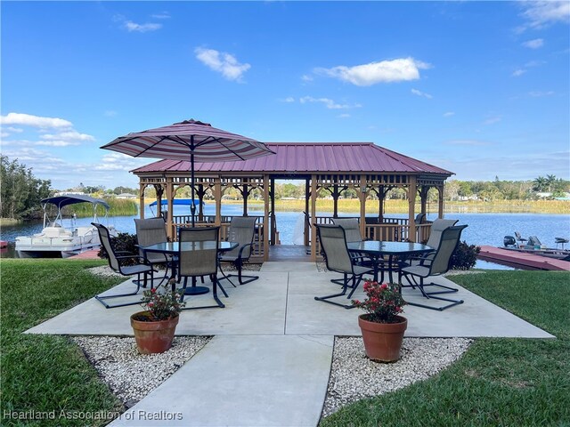 view of patio / terrace featuring a gazebo and a water view